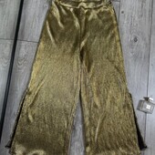 Круті штани широкі золоті мьякенькі по боках знизу розрізи что.опис