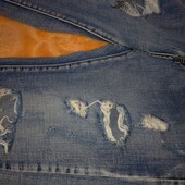 Рвані жіночі джинси